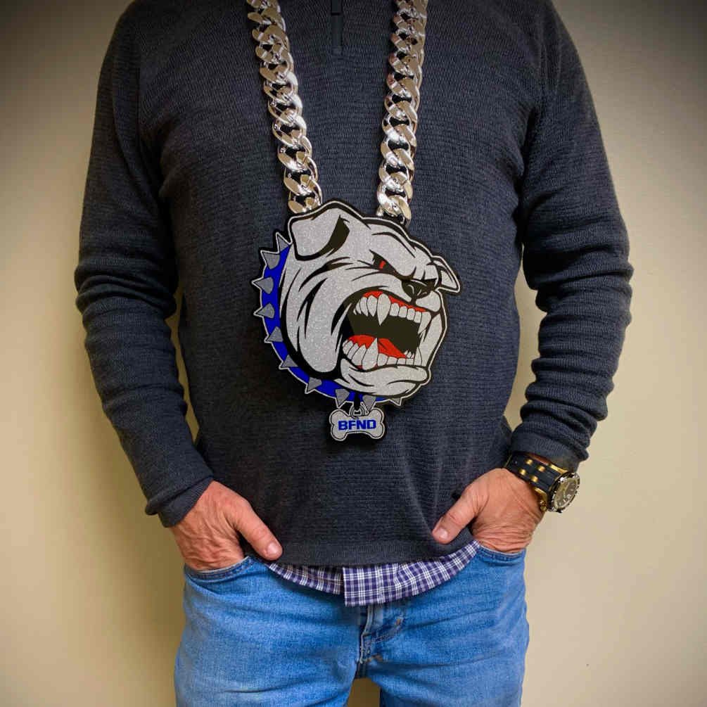 Bulldog mascot pendant with blue spiked collar detail.