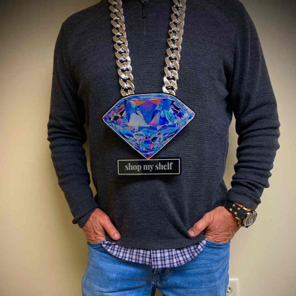 Blue diamond pendant with a shop my shelf text tag.