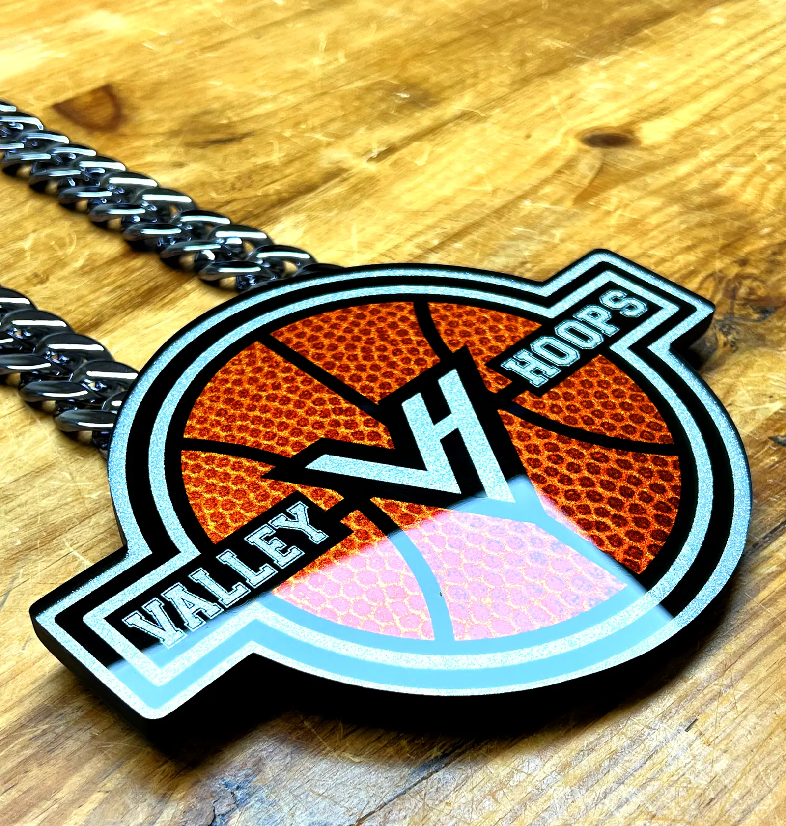 Valley Hoops VH pendant shown at an angle.